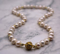 Gold and White Pearl Necklace